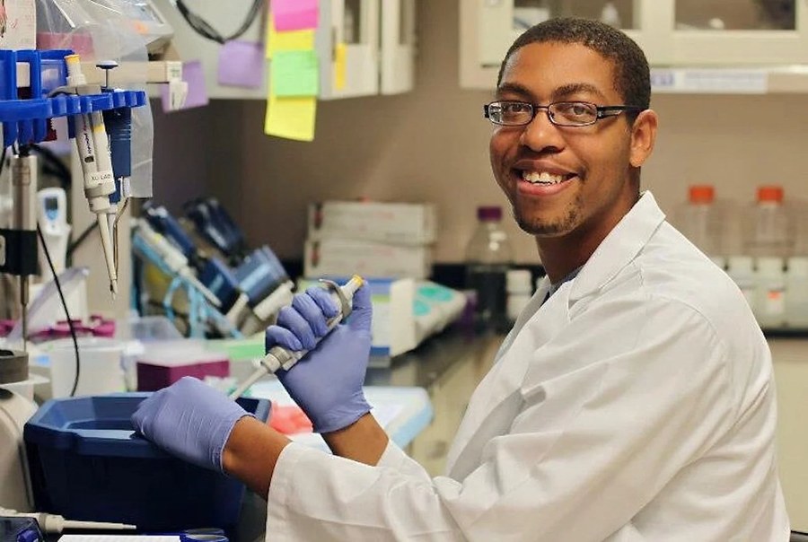 Smiling researcher in laboratory