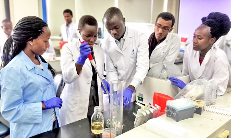 Diverse team of young scientists collaborating in laboratory